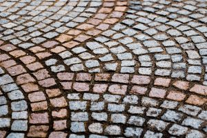Pros and Cons of Stamped Concrete vs Pavers